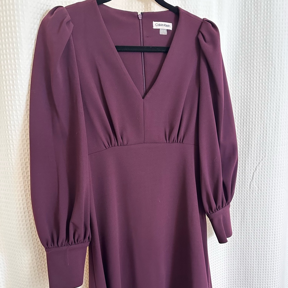 Calvin Klein high waist dress size 6. Cuff sleeves, zipper back.